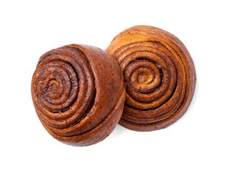 Photo of Delicious cinnamon roll buns isolated on white, top view