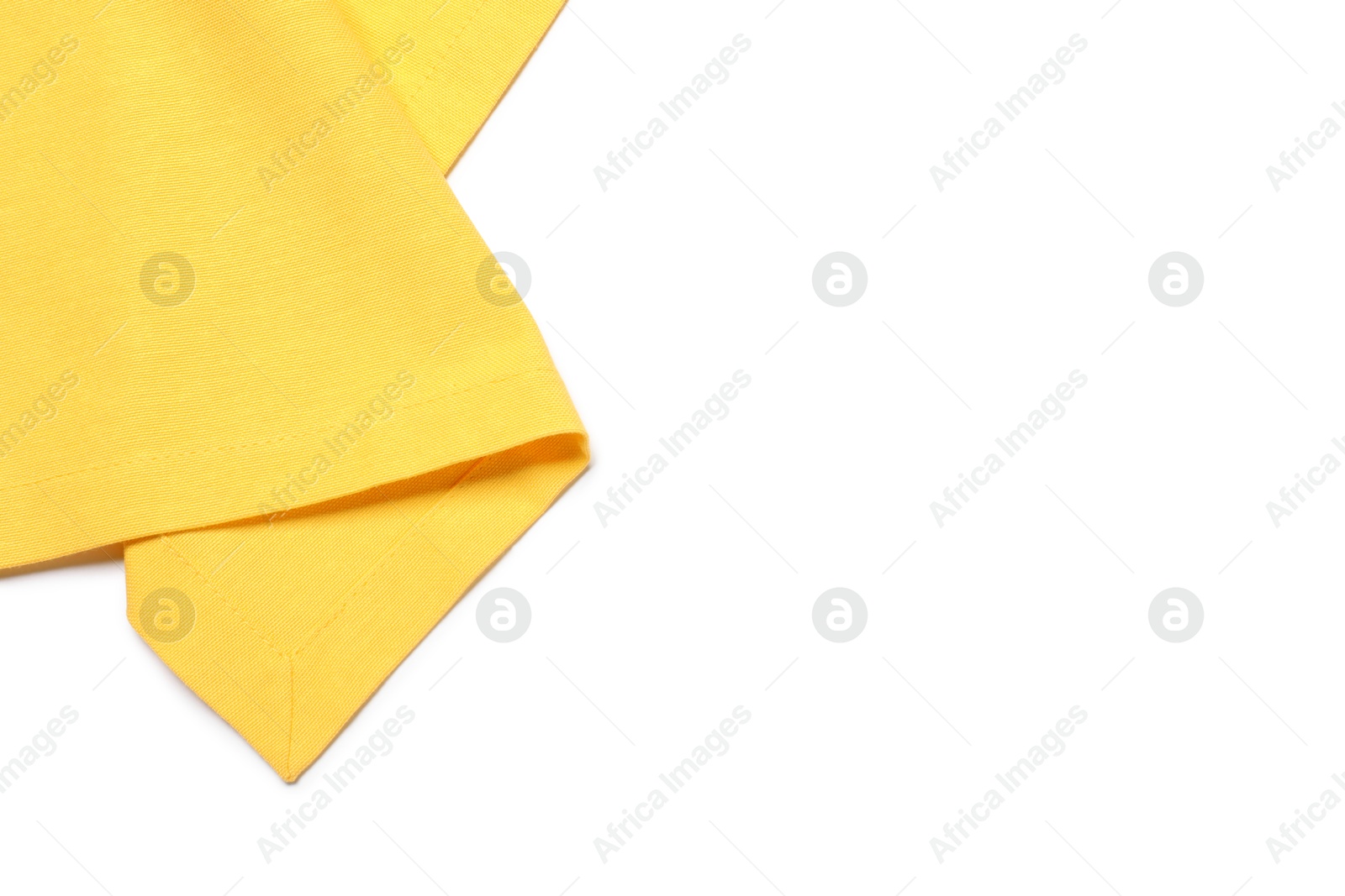 Photo of Yellow tablecloth isolated on white, top view