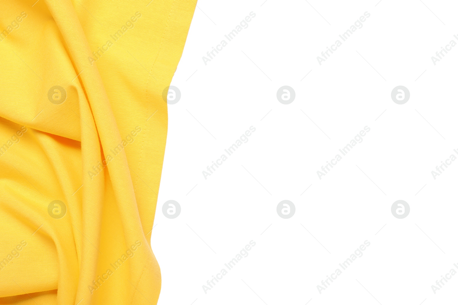 Photo of Yellow tablecloth isolated on white, top view