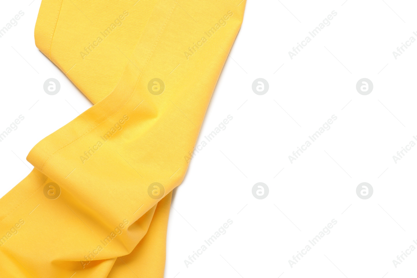 Photo of Yellow tablecloth isolated on white, top view