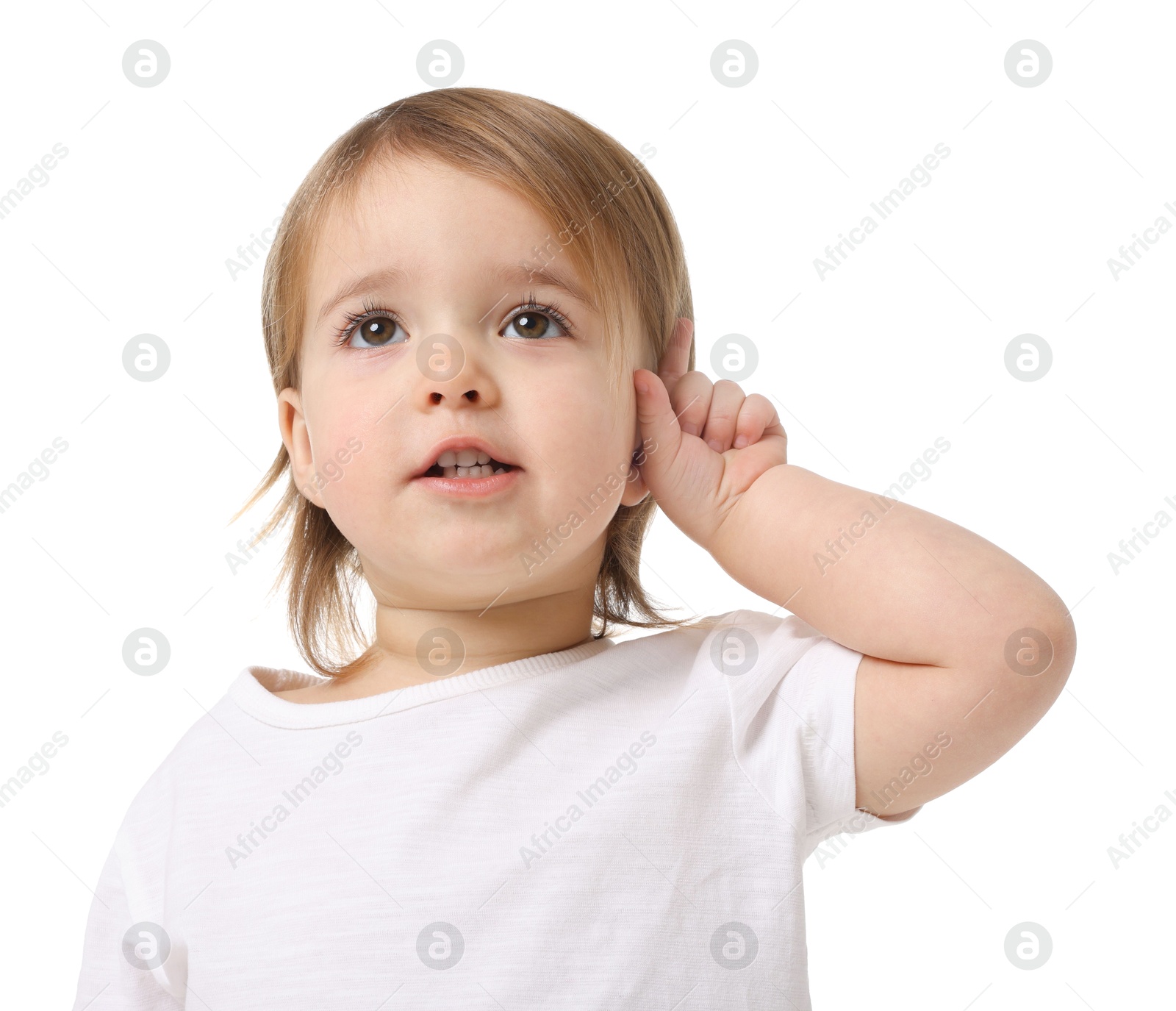 Photo of Cute little baby girl showing her ear on white background