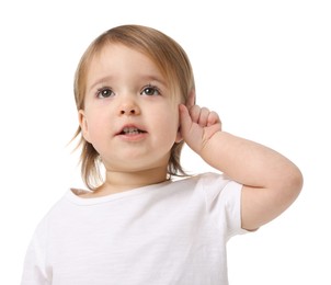 Photo of Cute little baby girl showing her ear on white background