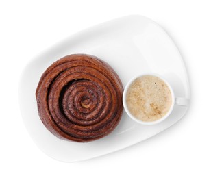 Photo of Delicious cinnamon roll and cup of coffee isolated on white, top view