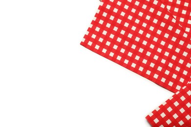 Photo of Red checkered tablecloth isolated on white, top view