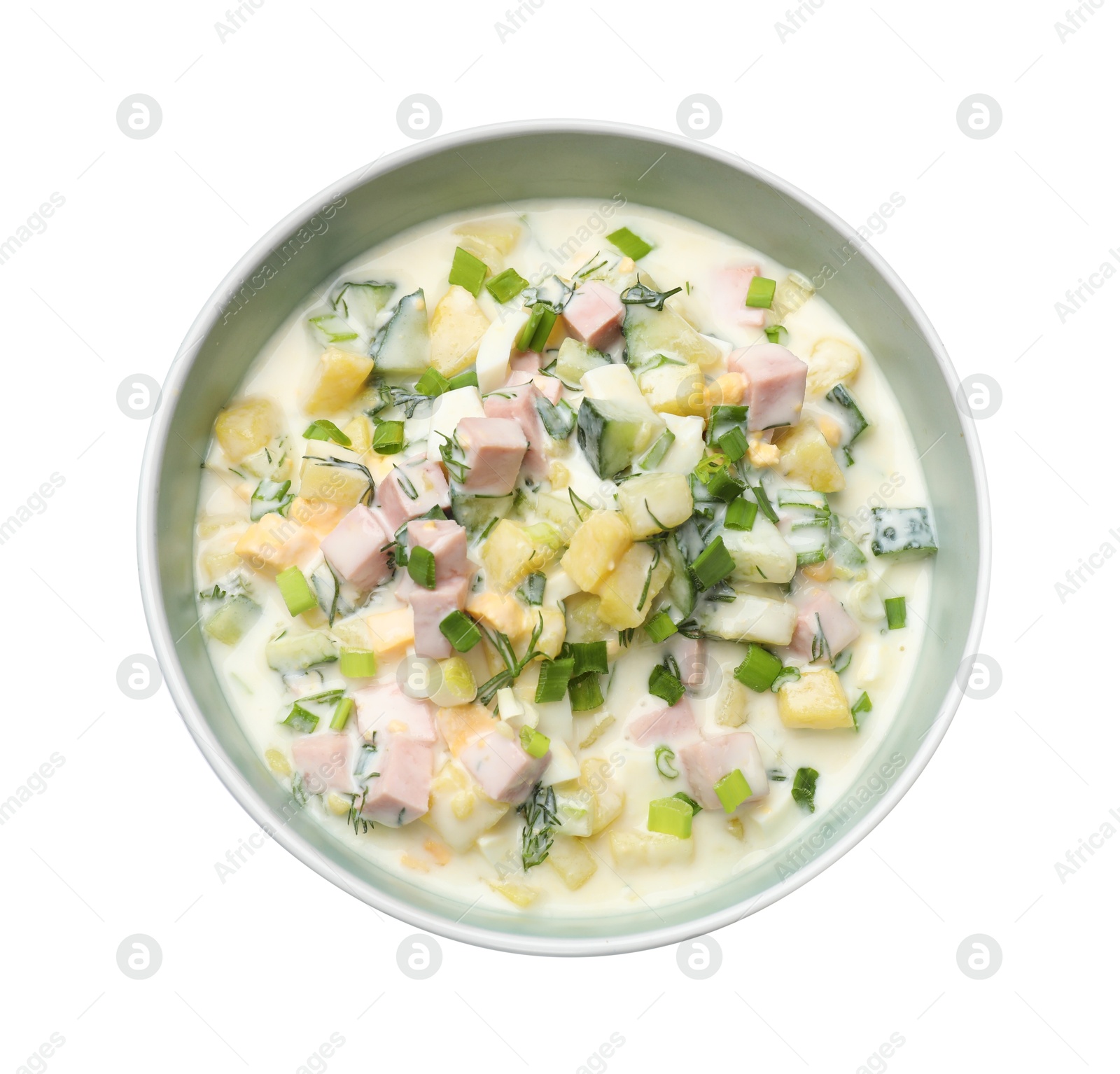 Photo of Delicious okroshka soup in bowl isolated on white, top view