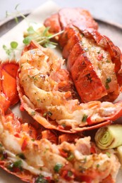 Photo of Delicious lobster tails with microgreens and green onion on table, above view