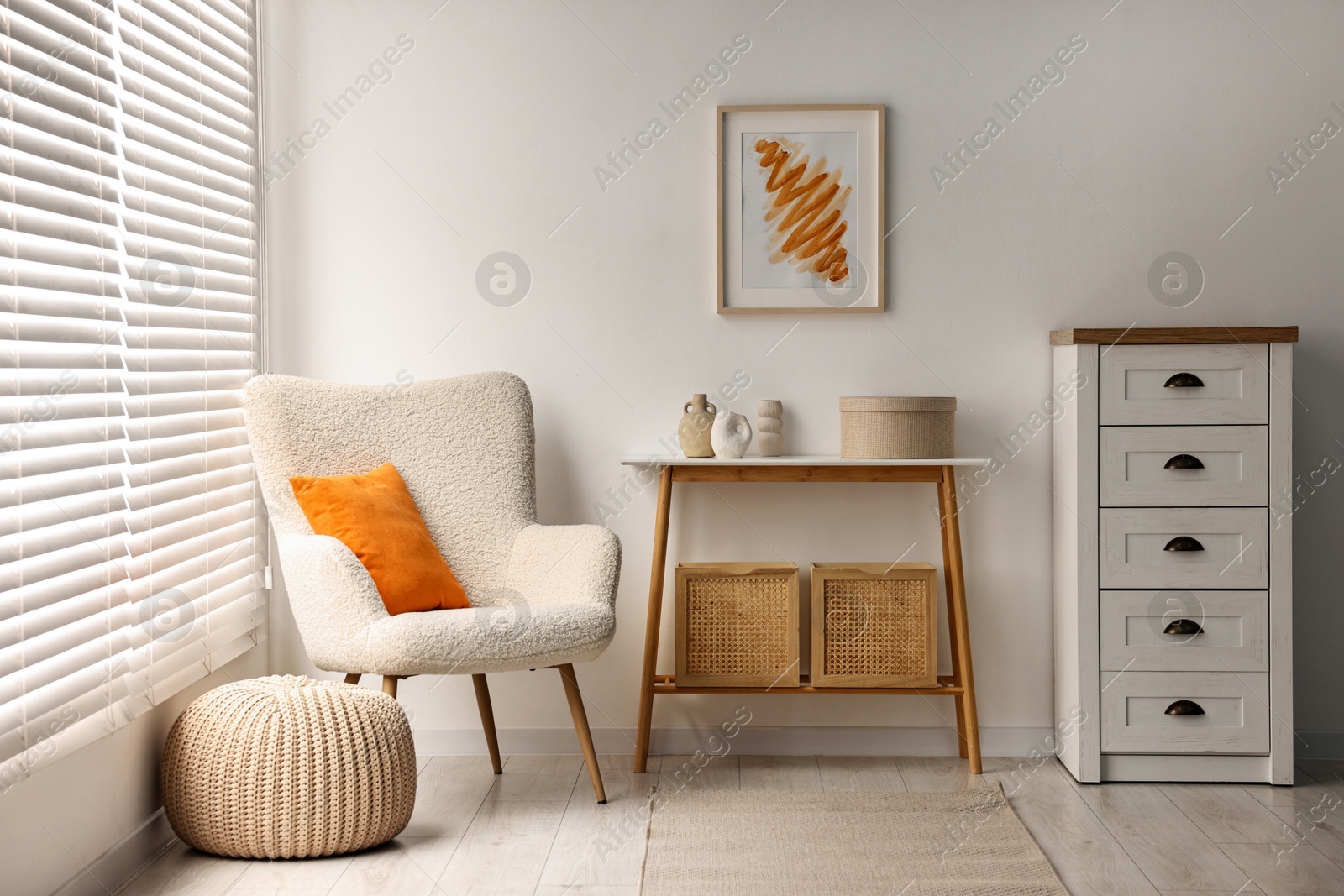 Photo of Stylish room interior with console table near white wall