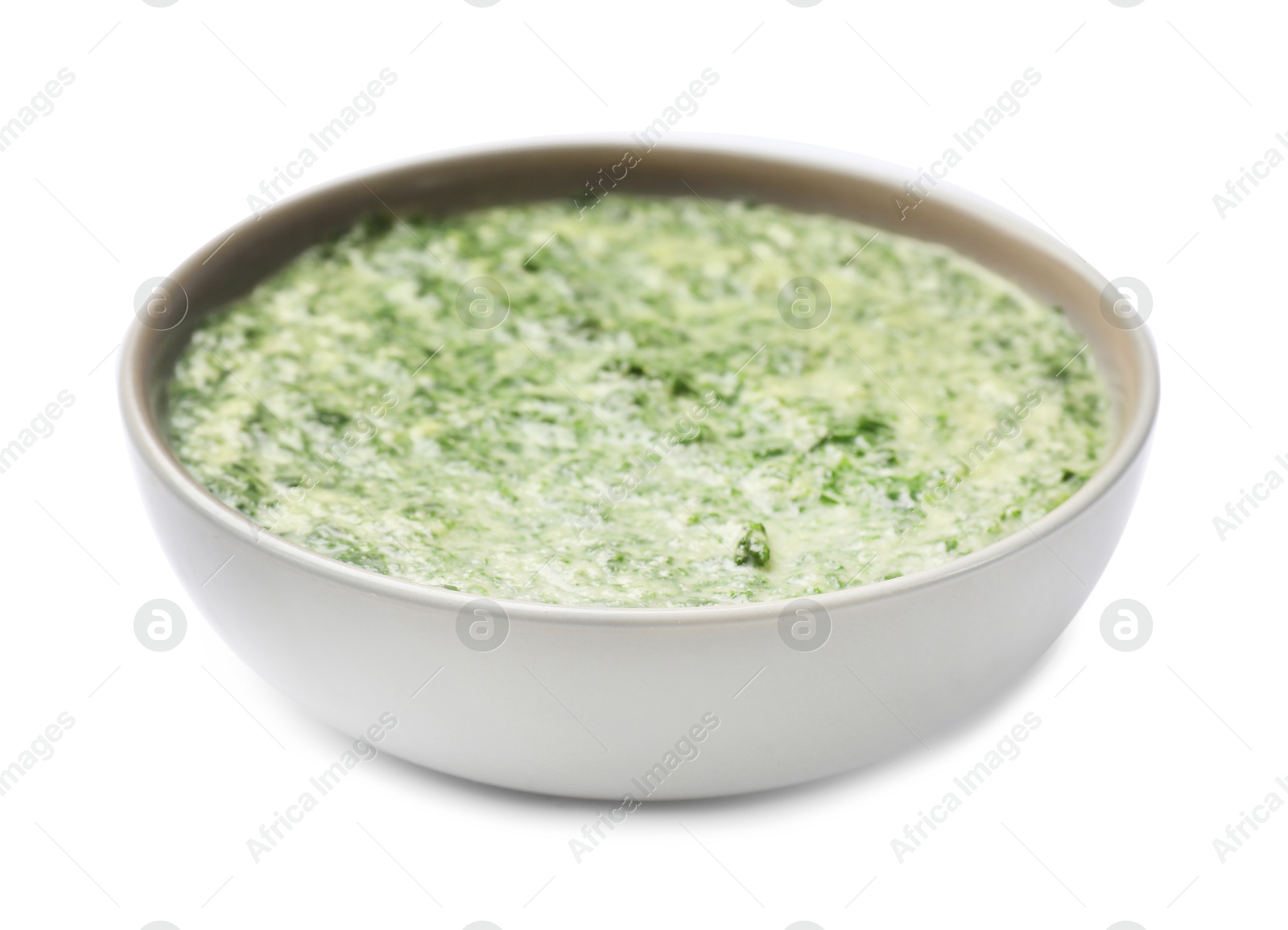 Photo of Delicious spinach sauce in bowl isolated on white