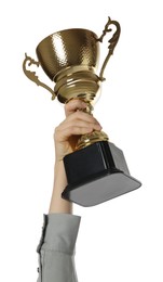 Woman with golden trophy cup on white background, closeup