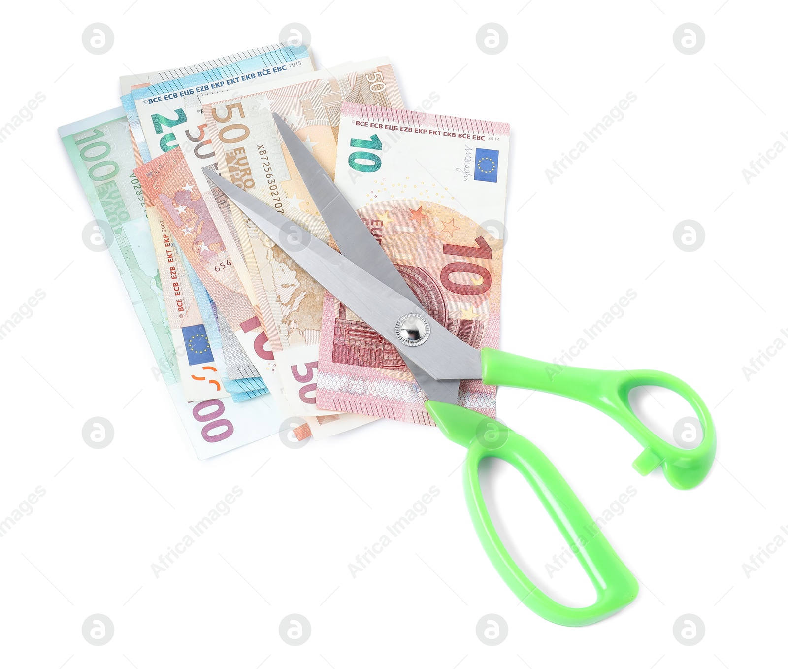 Photo of Euro banknotes and scissors isolated on white, top view