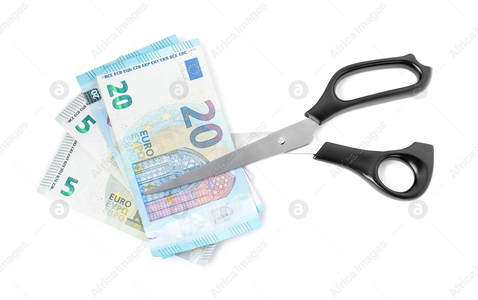 Photo of Euro banknotes and scissors isolated on white, top view