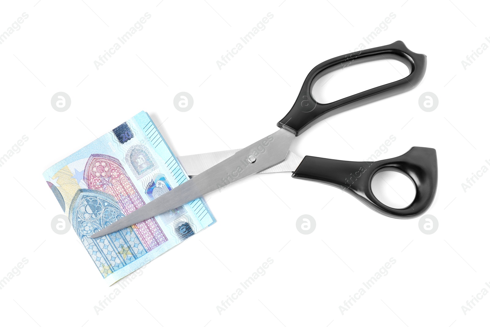 Photo of Scissors with euro banknote isolated on white, top view