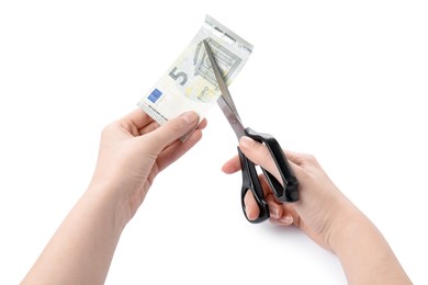 Photo of Woman cutting euro banknote on white background, closeup