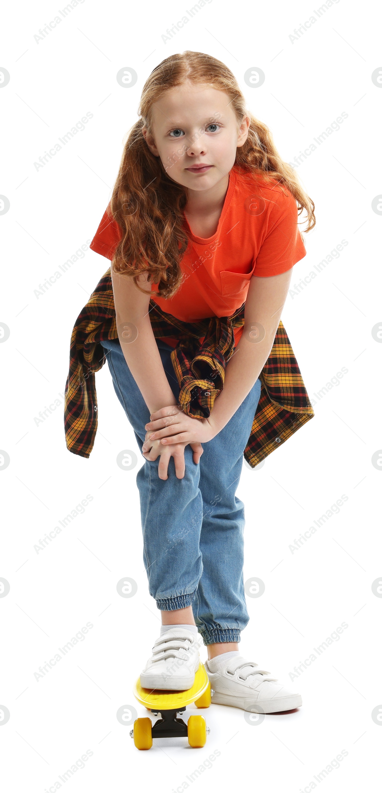 Photo of Stylish little girl with penny board on white background