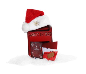 Photo of Santa Claus mail box with letters, hat and artificial snow isolated on white. Christmas tradition