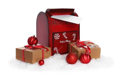 Photo of Santa Claus mail box with letter, gifts and artificial snow isolated on white. Christmas tradition