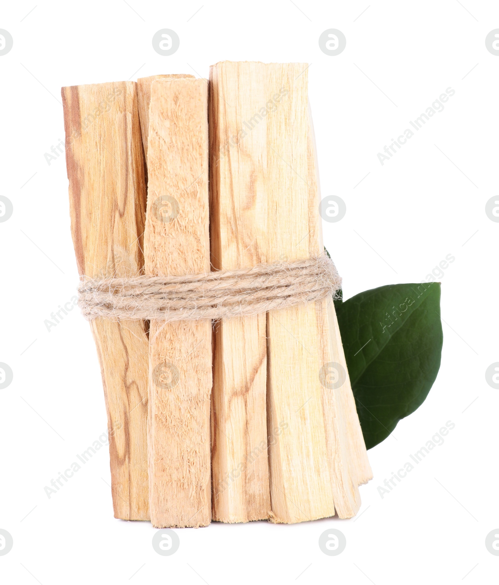 Photo of Bunch of palo santo sticks and green leaf on white background