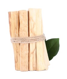 Bunch of palo santo sticks and green leaf on white background