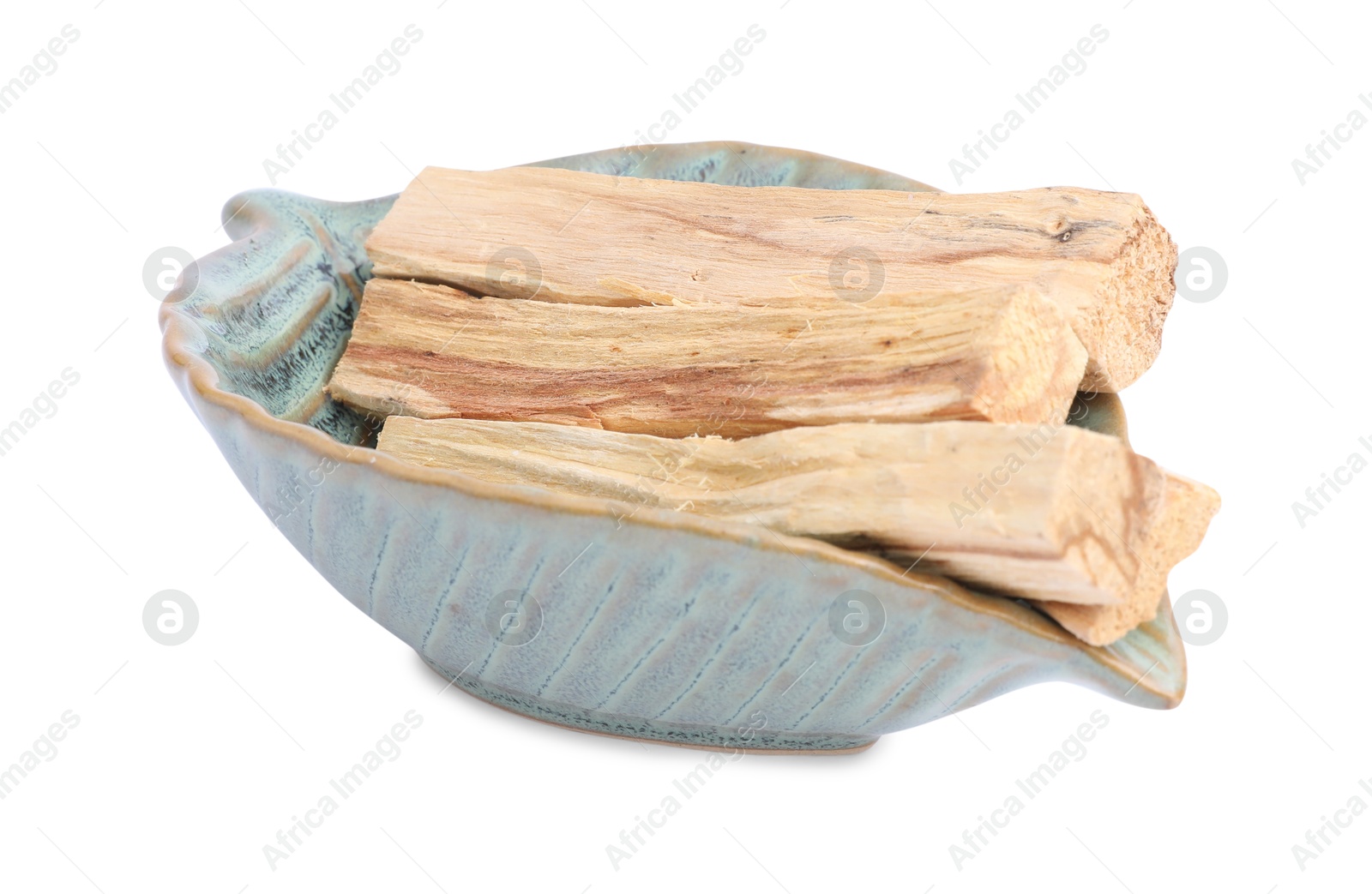 Photo of Palo santo sticks in ceramic bowl on white background