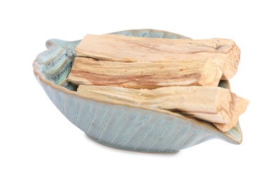 Photo of Palo santo sticks in ceramic bowl on white background