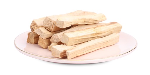 Photo of Pile of palo santo sticks on white background