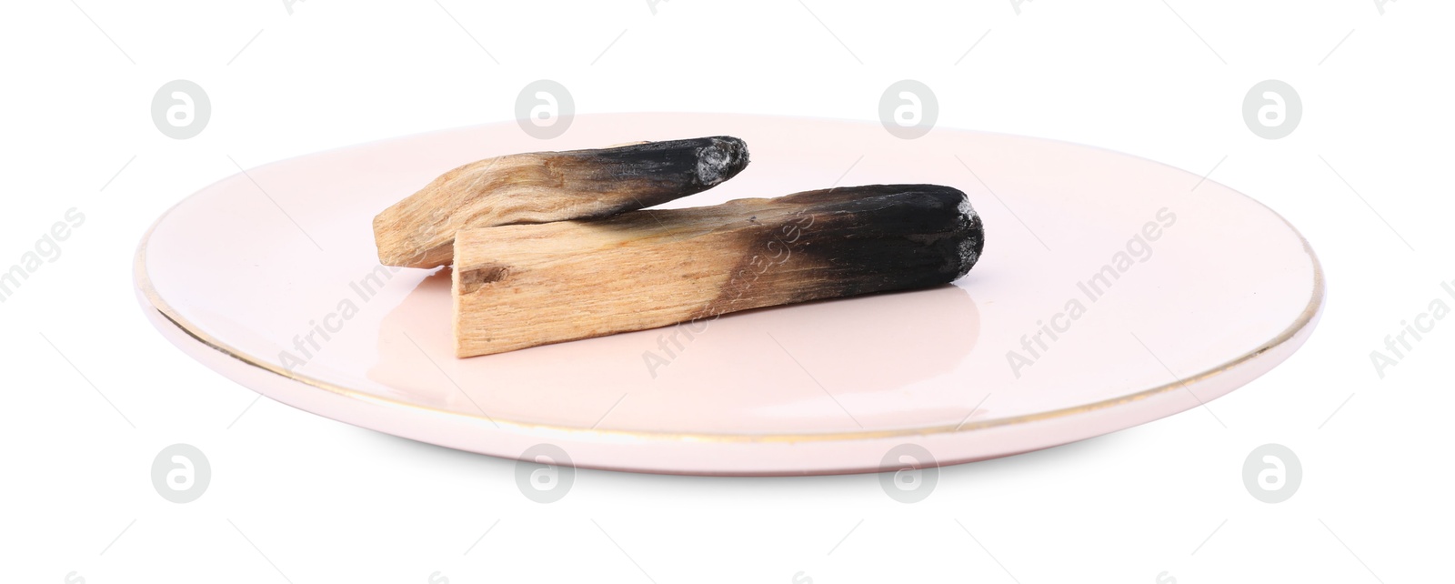 Photo of Burnt palo santo sticks on white background