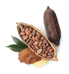 Cocoa pods with beans, powder, butter and leaves isolated on white, top view