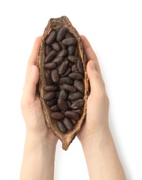 Woman holding cocoa pod with beans on white background, top view