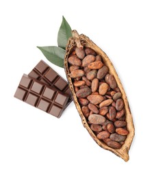 Photo of Cocoa pod with beans, chocolate and leaves isolated on white, top view