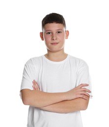 Photo of Portrait of teenage boy with crossed arms on white background