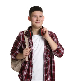 Photo of Portrait of teenage boy with headphones and backpack on white background