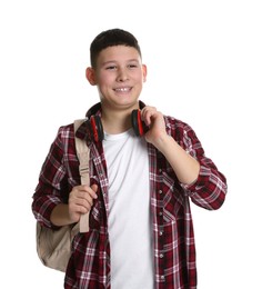 Photo of Portrait of teenage boy with headphones and backpack on white background