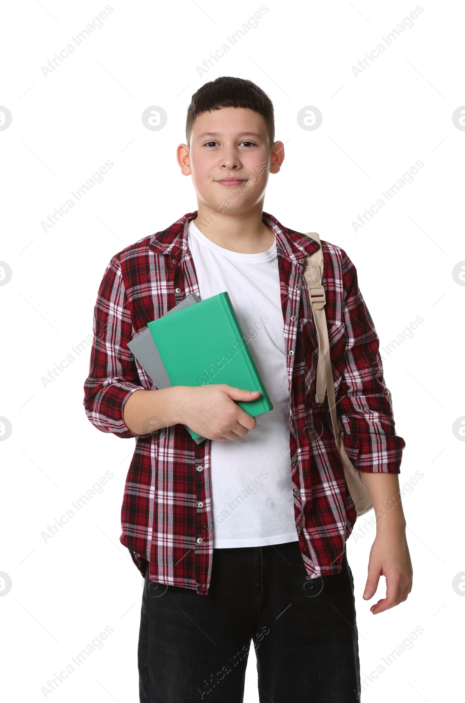 Photo of Portrait of teenage boy with books and backpack on white background