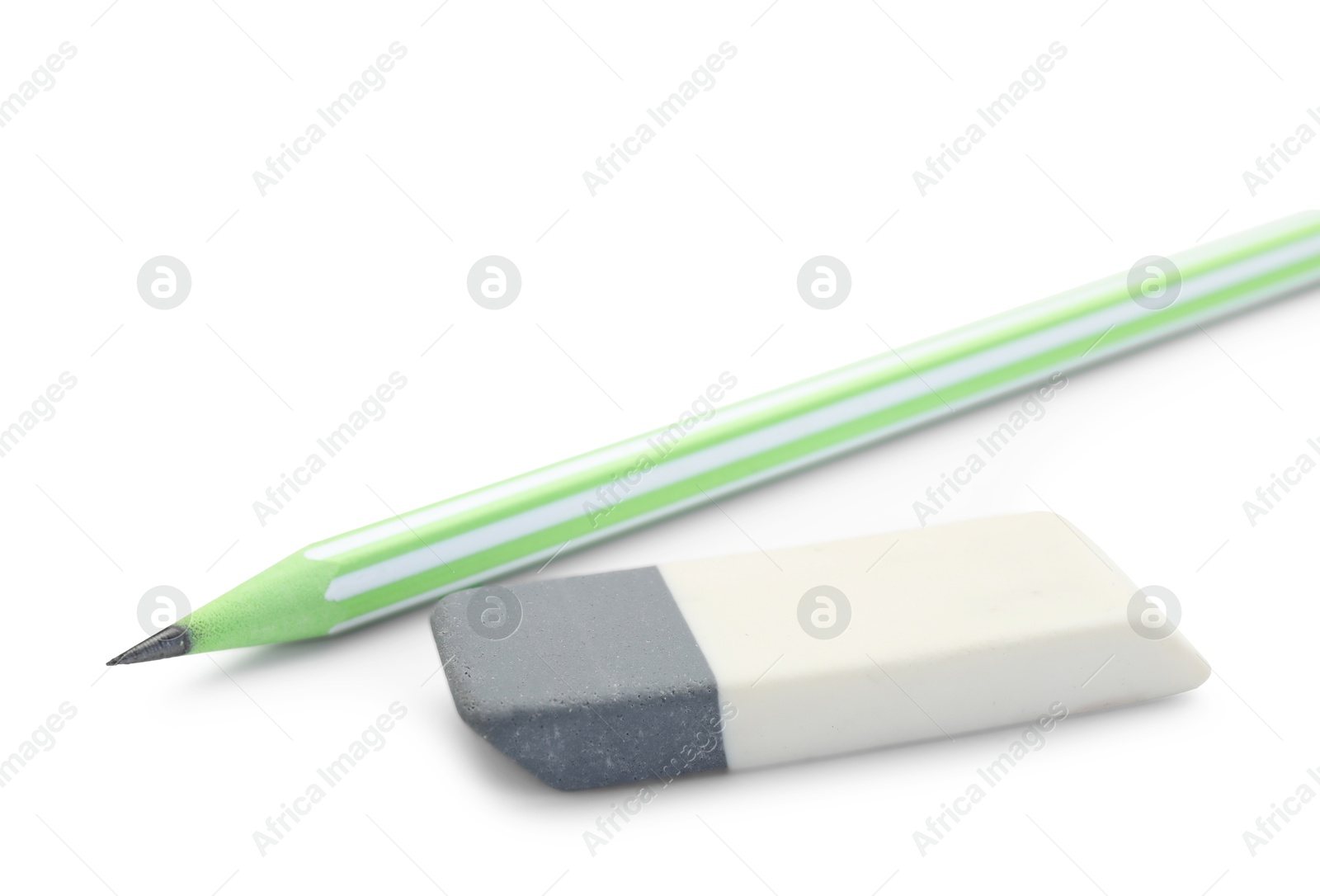 Photo of Eraser and pencil isolated on white. School stationery