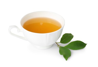 Photo of Refreshing green tea in cup and leaves isolated on white