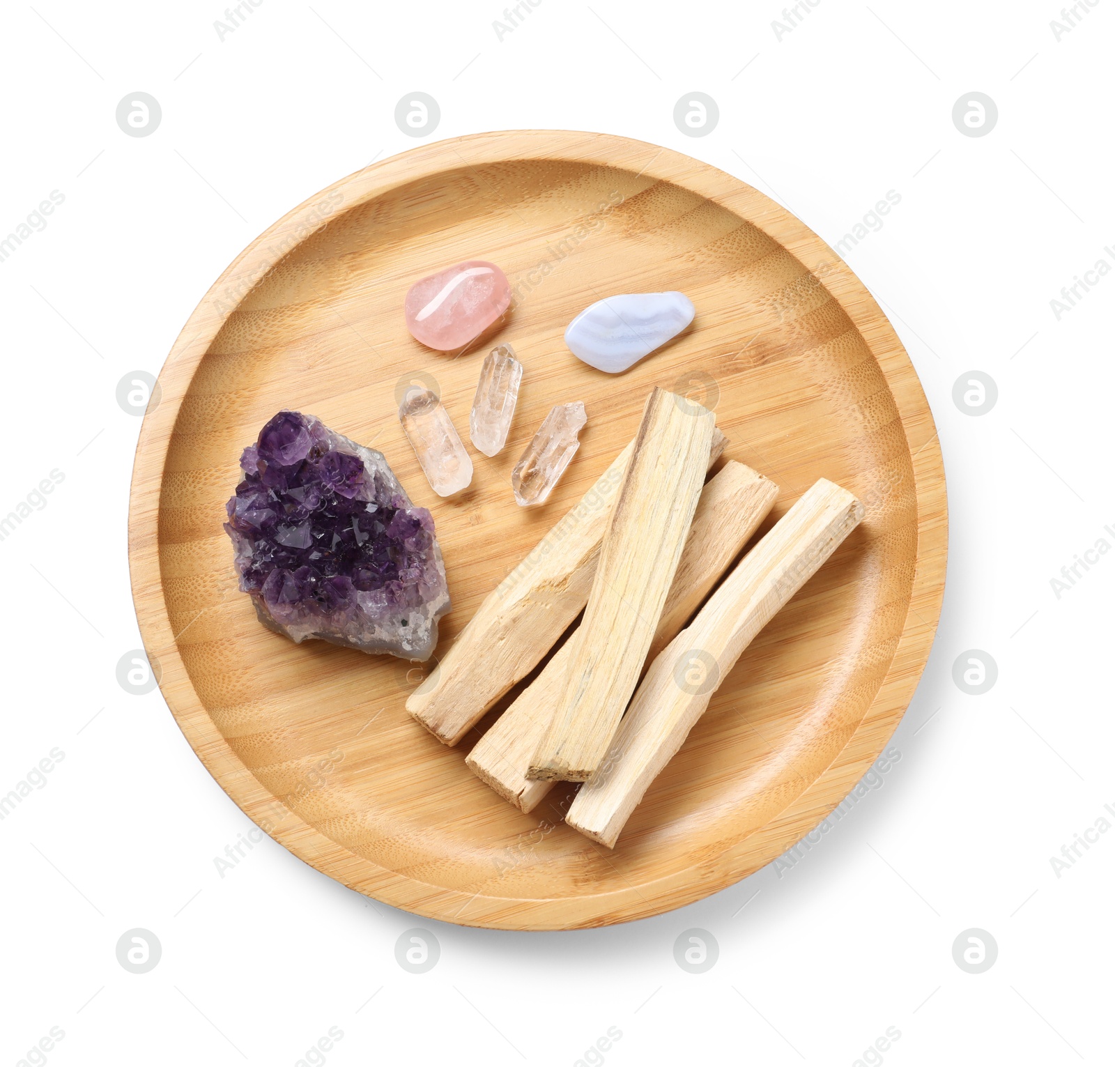 Photo of Palo santo sticks and gemstones isolated on white, top view