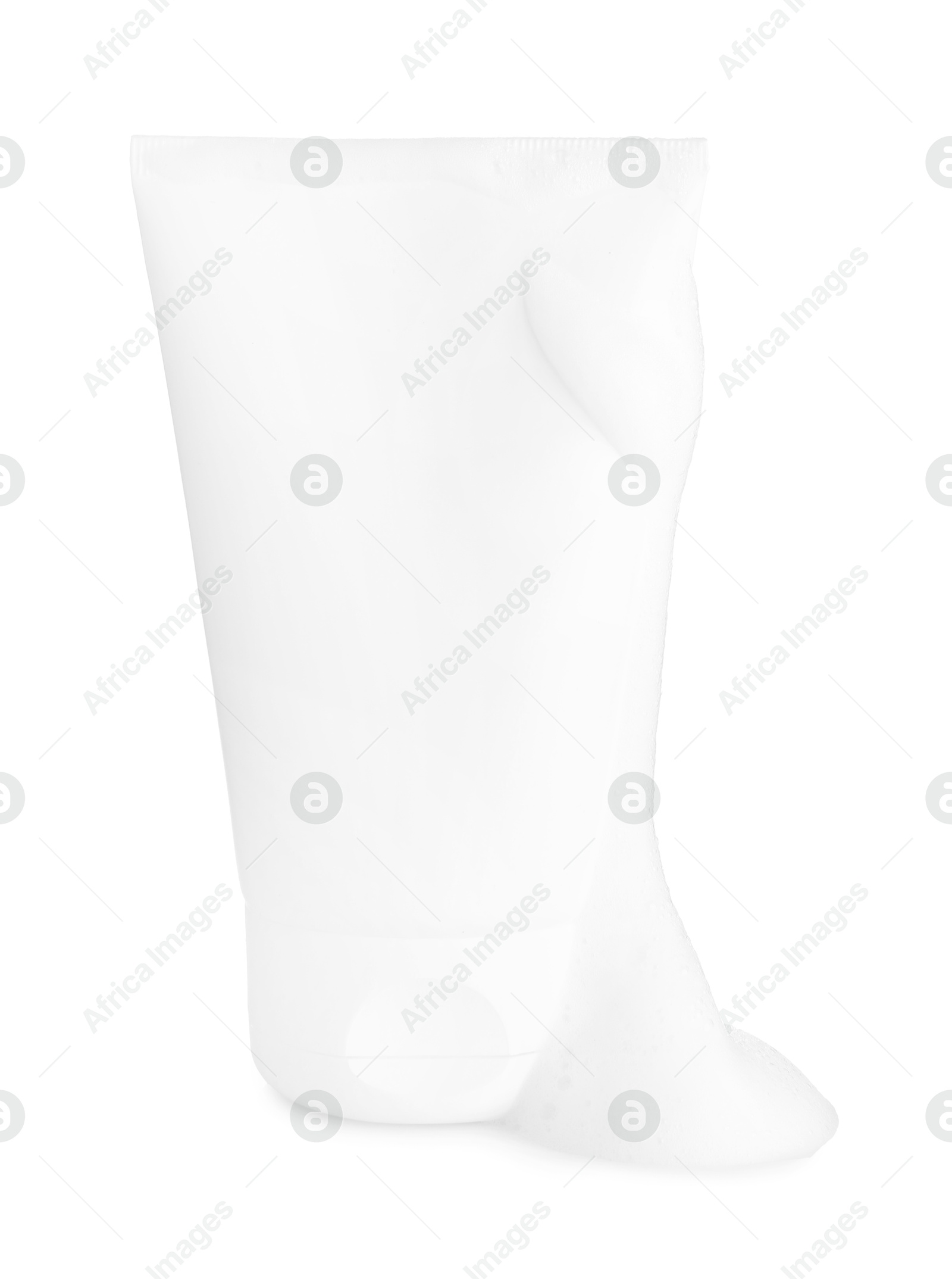 Photo of Tube of cosmetic product with foam isolated on white