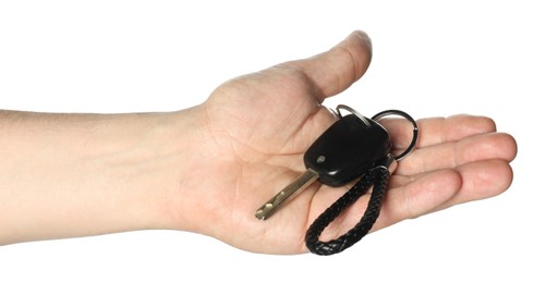 Photo of Man with car key and keychain on white background, closeup