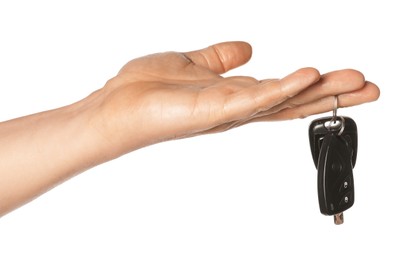 Man with car keys on white background, closeup