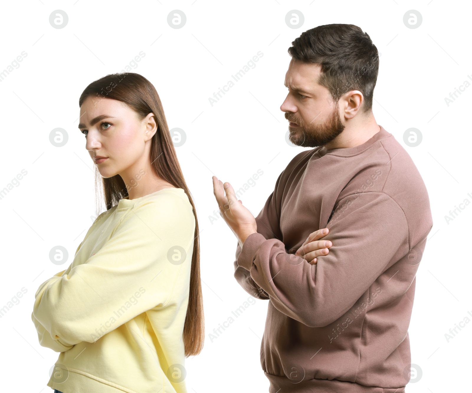 Photo of Resentful couple arguing on white background. Relationship problem