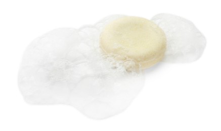 Photo of Round soap with foam on white background