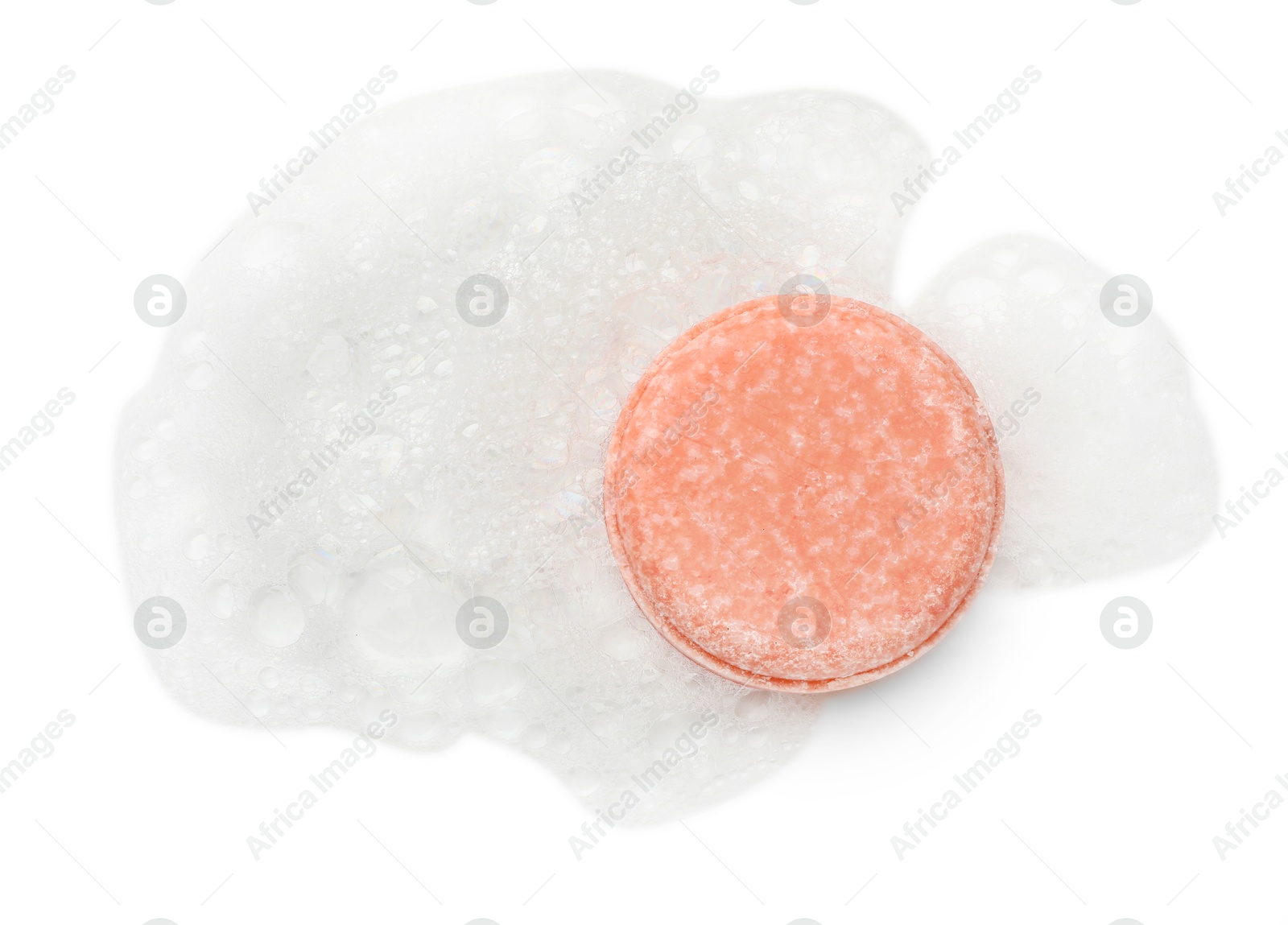 Photo of Pink soap with foam on white background, top view