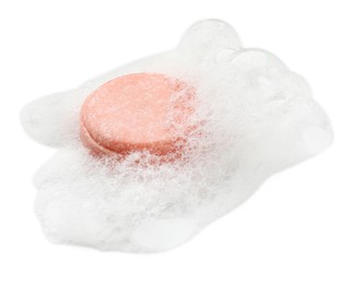 Photo of Pink soap with foam on white background