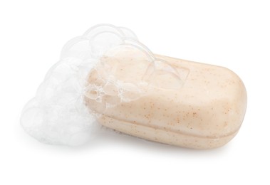 Photo of Bar soap with foam on white background