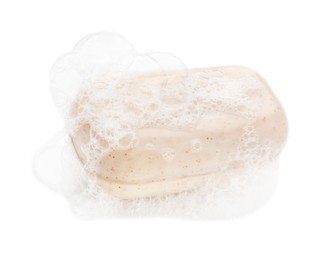 Photo of Bar soap with foam on white background