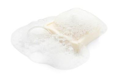 Photo of Bar soap with foam on white background