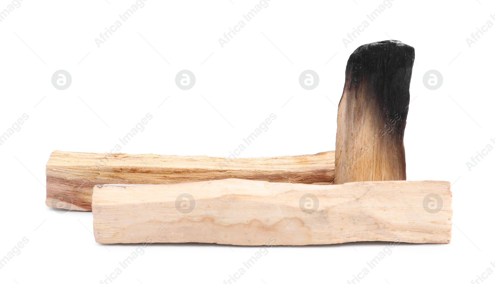 Photo of Whole palo santo sticks and burnt one on white background