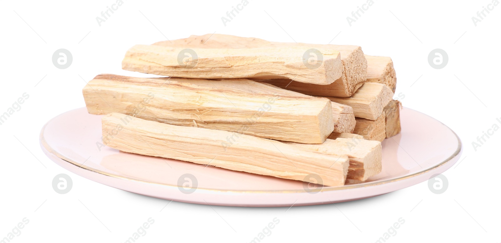 Photo of Pile of palo santo sticks on white background