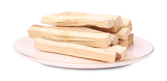 Photo of Pile of palo santo sticks on white background