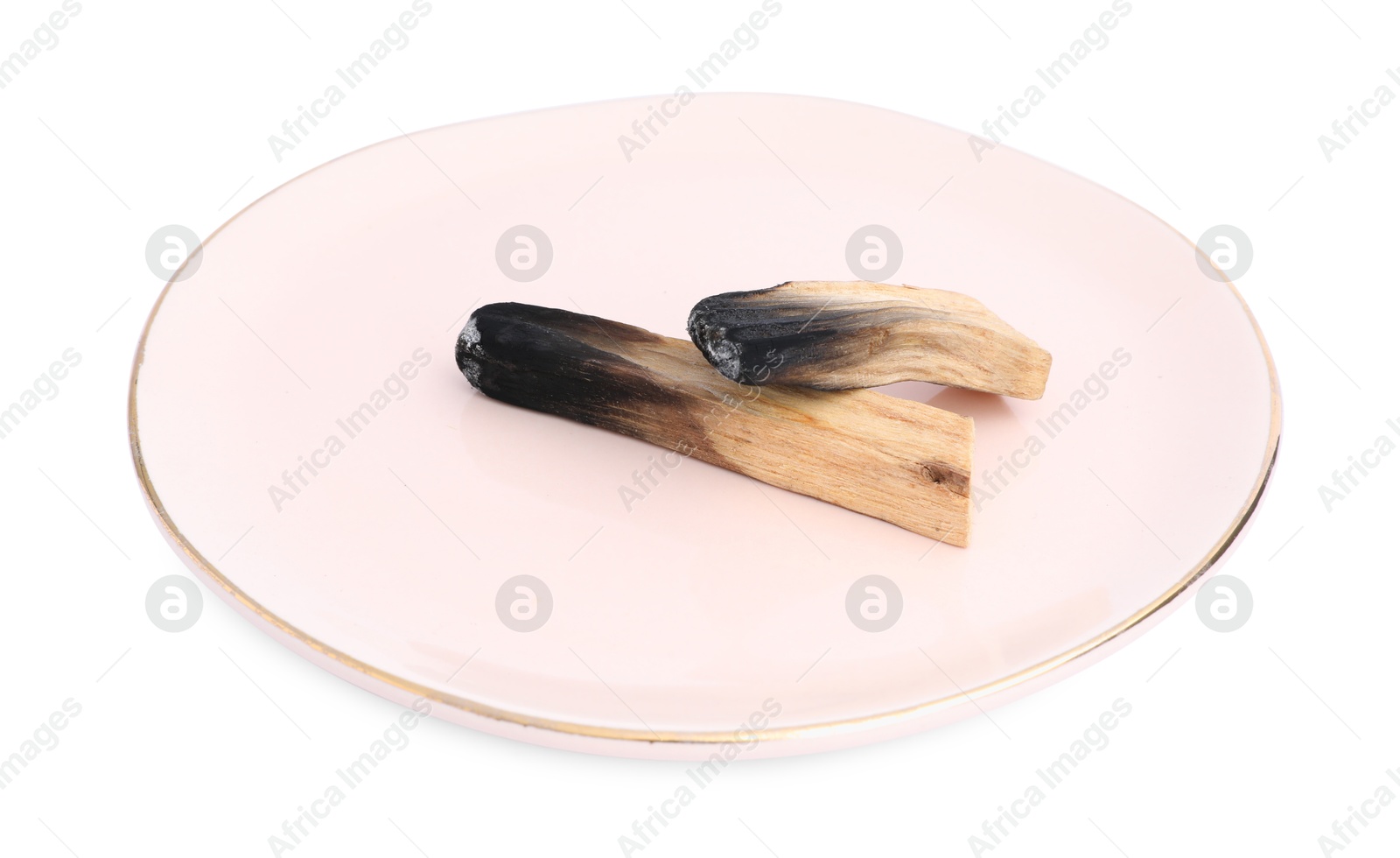 Photo of Burnt palo santo sticks on white background